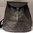Heidi Small and Round shape backpack in thick cellulose fiber.